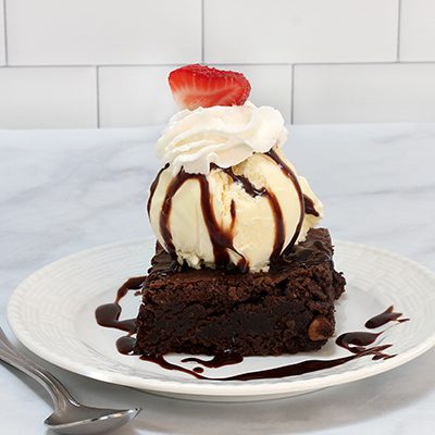 Brownie Ice Cream Sundae topped with a strawberry slice